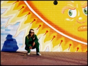 Nick painting a Canberra Building Wall